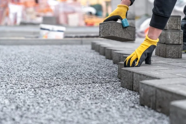 Block paving being hand placed by the Interlink Paving team in Liverpool